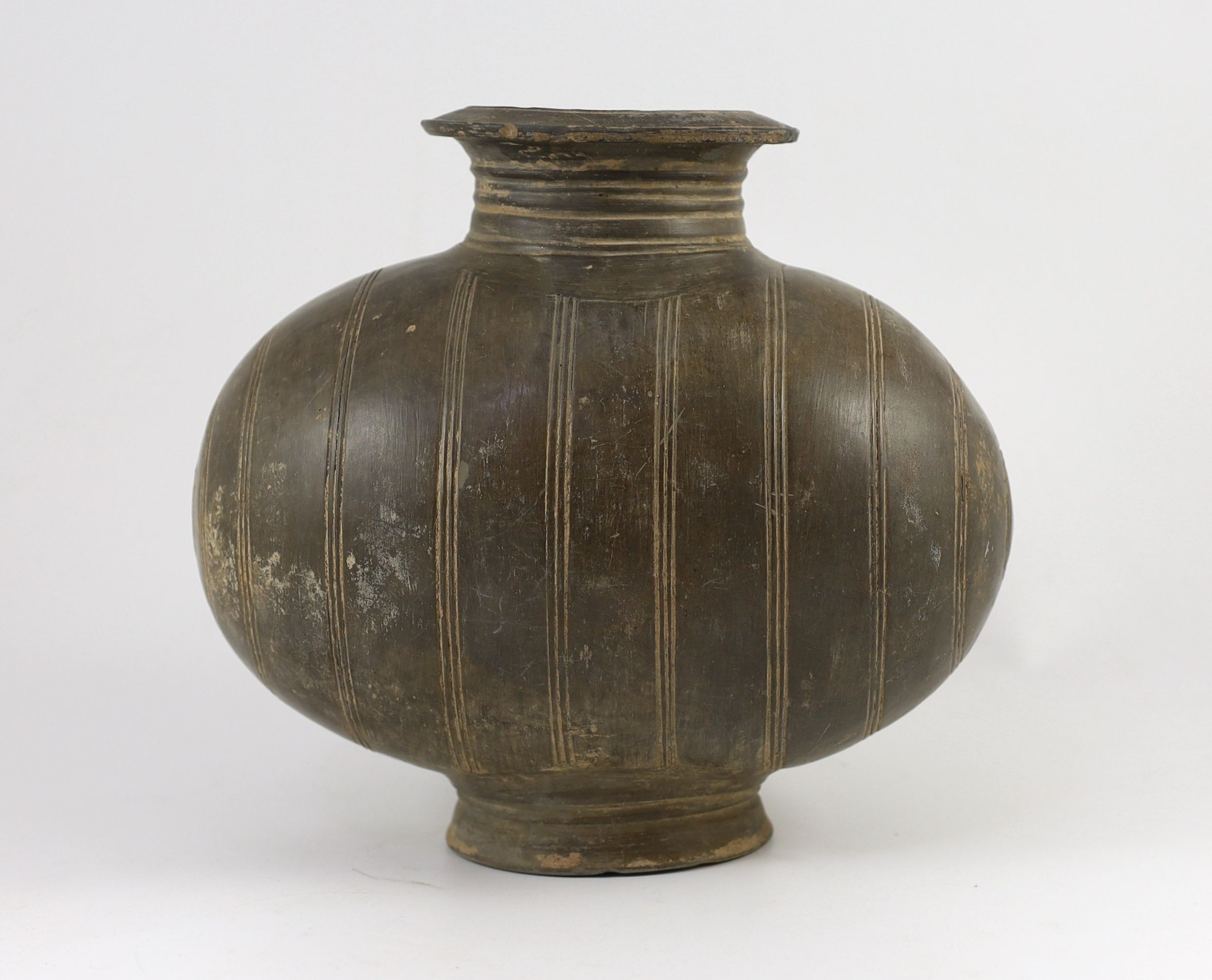 A Chinese black pottery cocoon-shaped jar, Western Han dynasty, (206 B.C.–A.D. 9) 25cm high